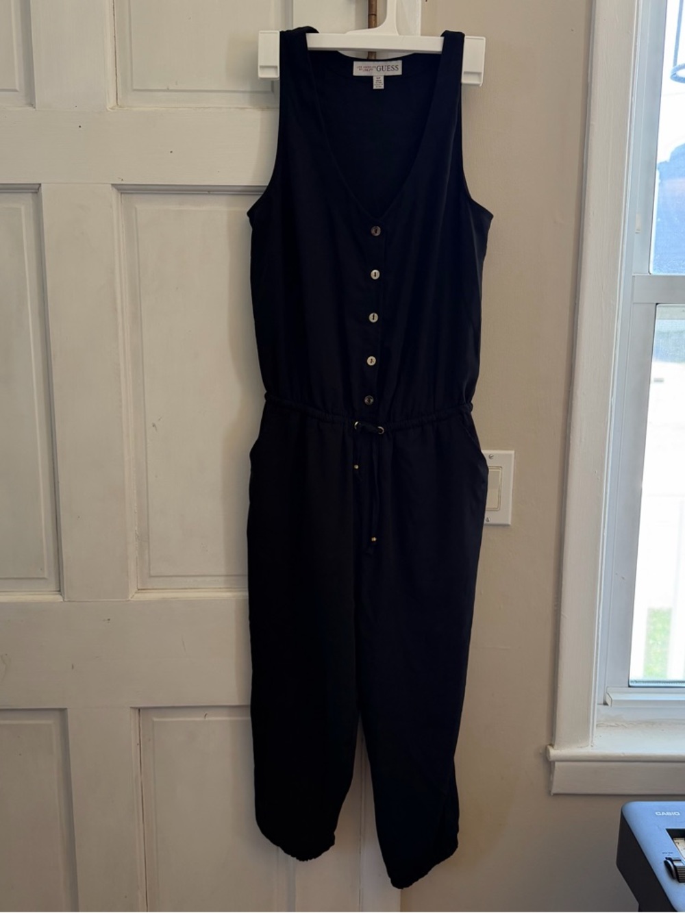 GUESS Black Jumpsuit | Sleeveless Button Front | Cinched Waist | Chic Minimal
